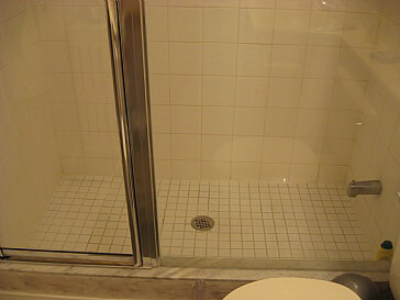 shower stall needs new tiles on floor
