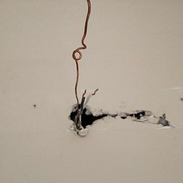 wires behind drywall/bathroom light
