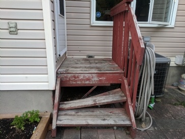 What is a suitable supporting structure for a back door landing and steps?