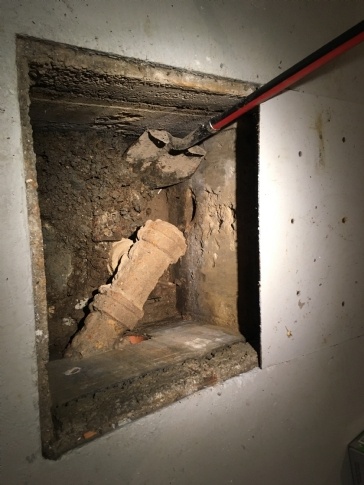 How do I deal with a smelly basement drain pit?