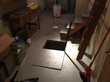 How do I deal with a smelly basement drain pit?