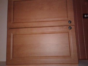 Veneer fibreboard light brown kitchen cupboards to an off white