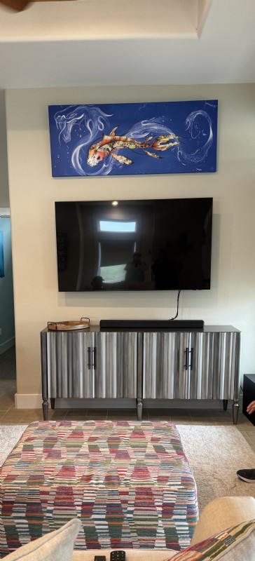 What can I replace a wall painting above a tv with?