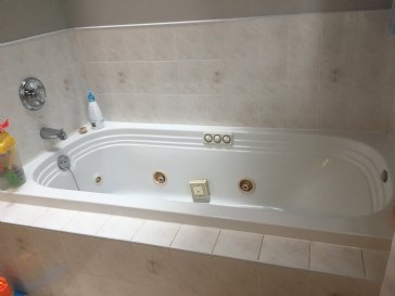 Time and cost of replacing an old en-suite jacuzzi tub