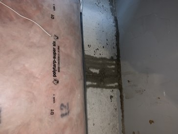 Water seeping through bottom of basement wall and floor