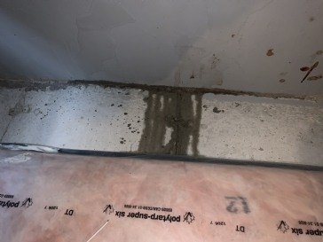 Water seeping through bottom of basement wall and floor