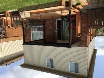 Hip roof covered swim spa with deck surround
