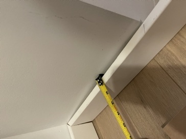 Baseboards on uneven wall