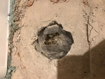 What is this access hole in basement slab?