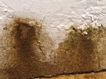 What is causing concrete wall leak?
