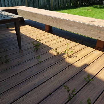 Best barrier to restrict weeds/sapling growth under a deck?