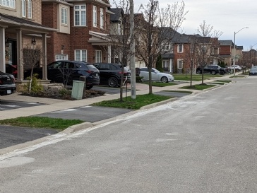 Neighbour's Concrete Contractor made a mess of the street staining multiple driveways