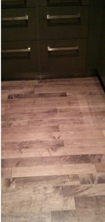 Damaged engineered hardwood floor in kitchen. Options?