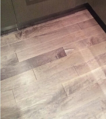 Damaged engineered hardwood floor in kitchen. Options?