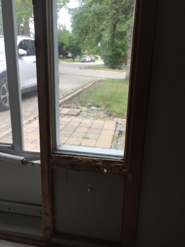 Cost to replace the wood moulding around the window connected to my door