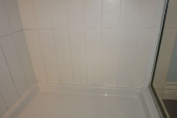 What to do when there is too much moisture behind shower tiles?