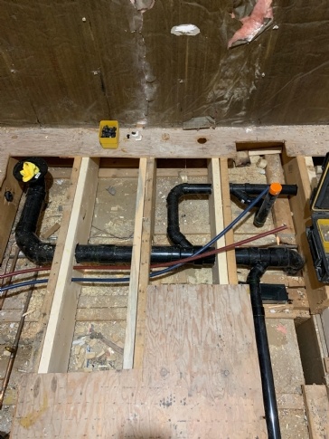 Drill 3 1/2 " hole through 3 joists for toilet pipe 