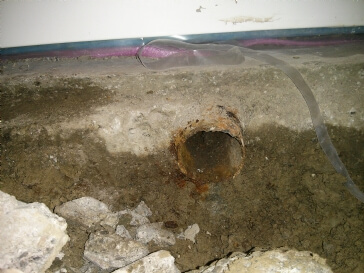 Best way to repair water seepage coming from concrete basement floor?