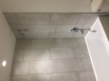 What is roughly cost per sq ft grout and tile installation?