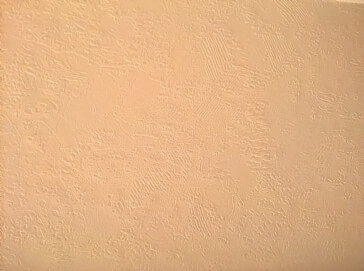 How can I fix this wall with the wallpaper still intact?