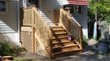 What would it cost to stain my stairs and add iron pickets?