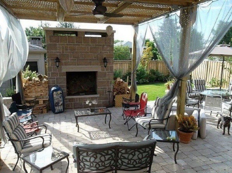 Exterior patio with stone fireplace