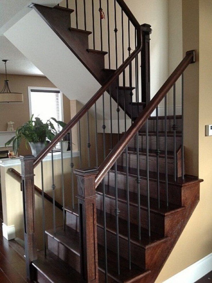 Oak staircase with wrought iron pickets