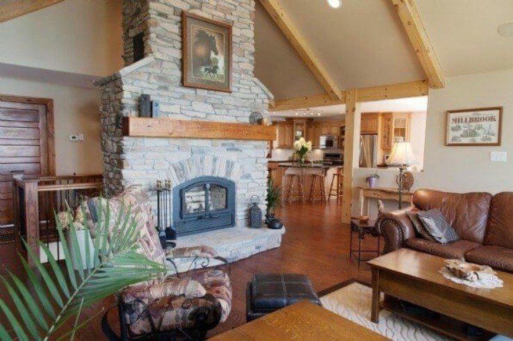 Stone fireplace with timber frame accents